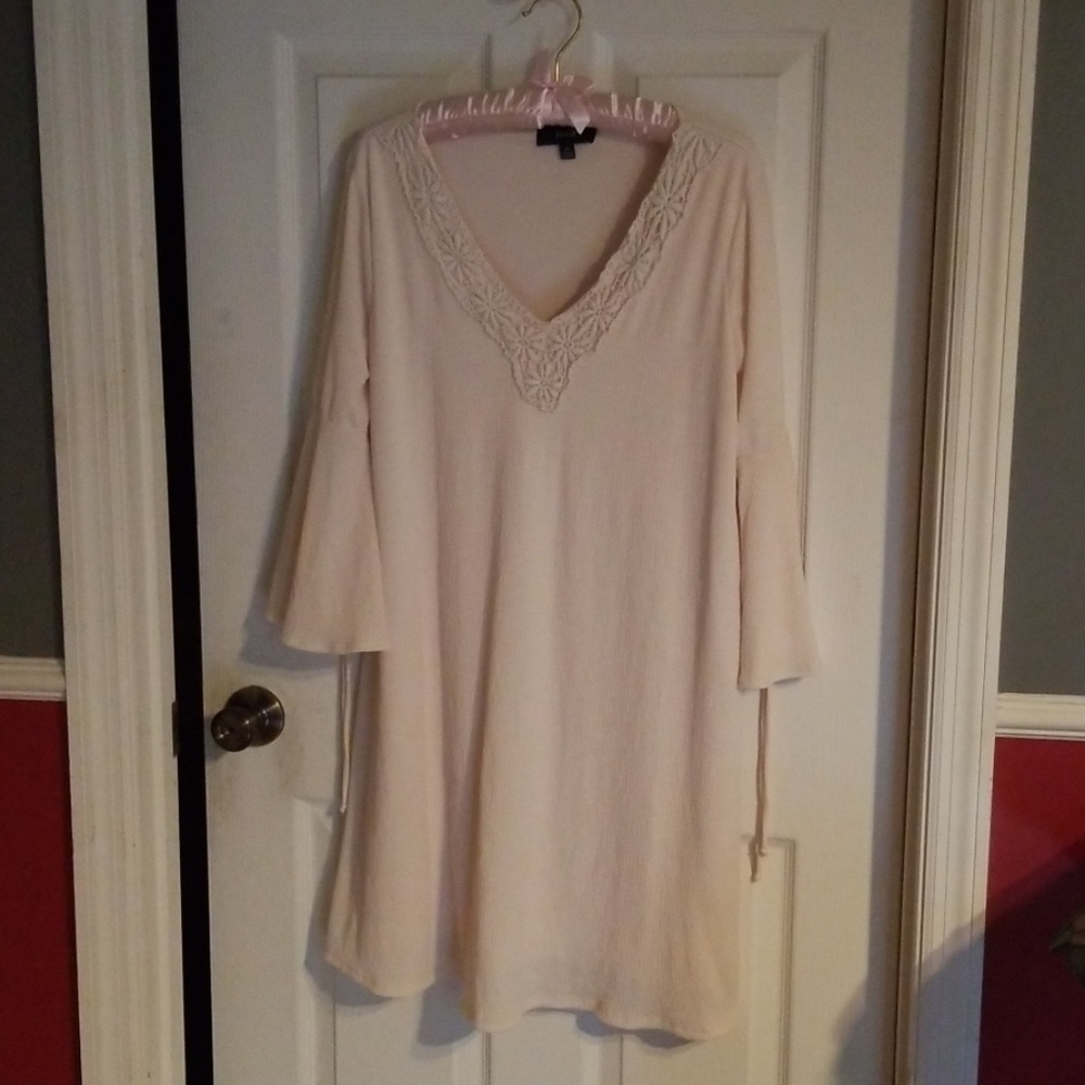 Cream Dress with flare arms, mid length.
